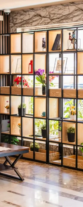 Lounge seating area with decorative shelving, Best Trip Paris