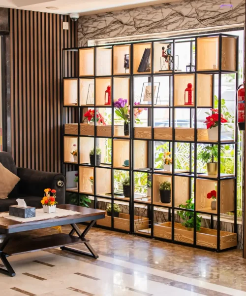 Lounge seating area with decorative shelving, Best Trip Paris