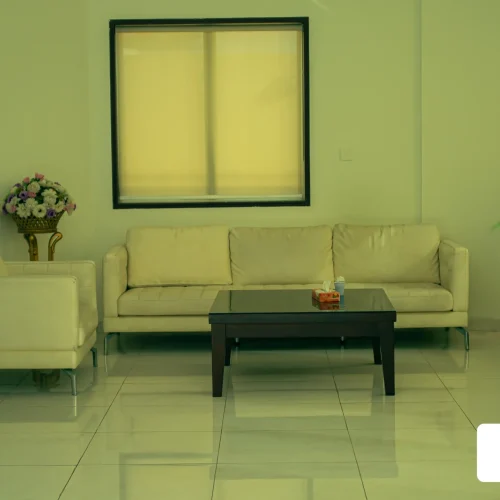 Hotel seating area with sofas and flower arrangements, Al Andalus Tolen Hotel